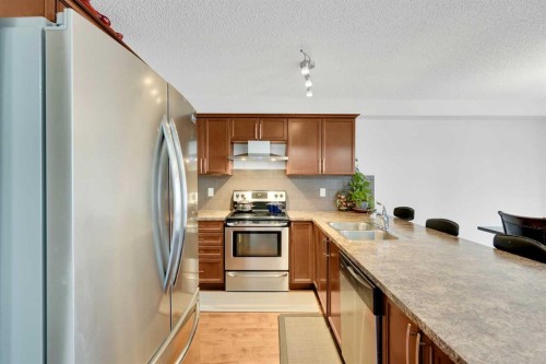 209 Windford Park Sw, Airdrie, AB - Indoor Photo Showing Kitchen With Stainless Steel Kitchen With Double Sink