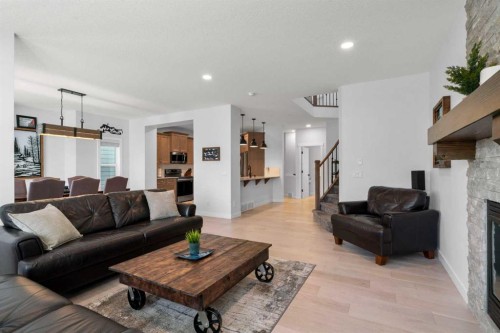99 Ridge View Close, Cochrane, AB - Indoor Photo Showing Living Room With Fireplace