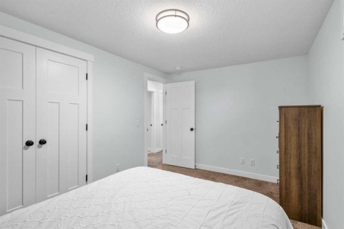 99 Ridge View Close, Cochrane, AB - Indoor Photo Showing Bedroom