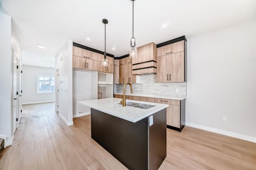 1947 Mccaskill Drive, Crossfield, AB - Indoor Photo Showing Kitchen With Double Sink With Upgraded Kitchen