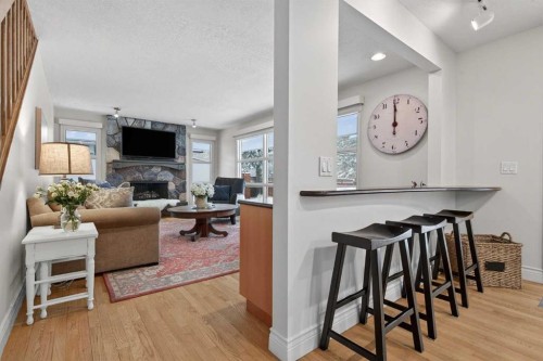 6913 Leaside Drive Sw, Calgary, AB - Indoor With Fireplace
