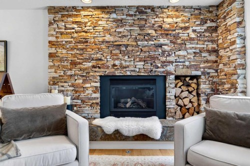 6913 Leaside Drive Sw, Calgary, AB - Indoor Photo Showing Living Room With Fireplace
