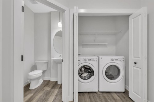 235 Kinniburgh Road, Chestermere, AB - Indoor Photo Showing Laundry Room