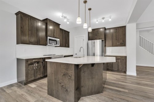 235 Kinniburgh Road, Chestermere, AB - Indoor Photo Showing Kitchen With Stainless Steel Kitchen With Upgraded Kitchen