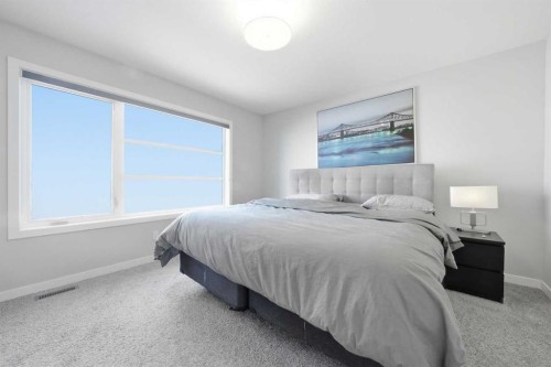 704 Creekstone Circle Sw, Calgary, AB - Indoor Photo Showing Bedroom