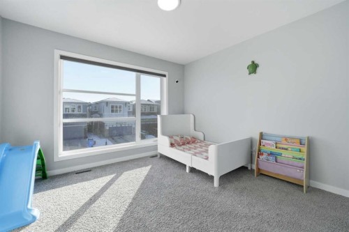 704 Creekstone Circle Sw, Calgary, AB - Indoor Photo Showing Bedroom