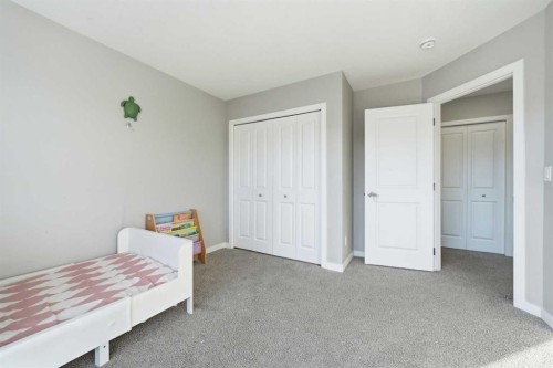704 Creekstone Circle Sw, Calgary, AB - Indoor Photo Showing Bedroom