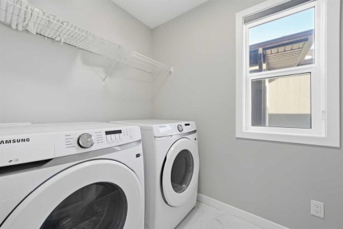 704 Creekstone Circle Sw, Calgary, AB - Indoor Photo Showing Laundry Room