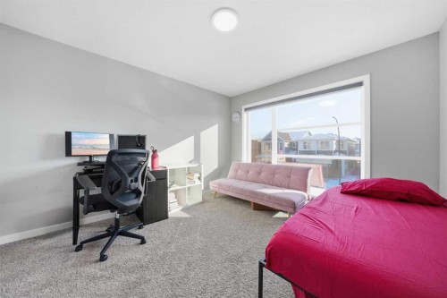 704 Creekstone Circle Sw, Calgary, AB - Indoor Photo Showing Bedroom