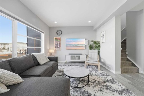 704 Creekstone Circle Sw, Calgary, AB - Indoor Photo Showing Living Room