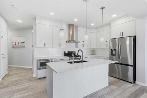 704 Creekstone Circle Sw, Calgary, AB - Indoor Photo Showing Kitchen With Double Sink With Upgraded Kitchen