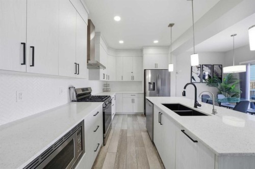 704 Creekstone Circle Sw, Calgary, AB - Indoor Photo Showing Kitchen With Double Sink With Upgraded Kitchen