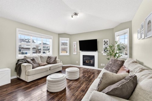 108 Cimarron Grove Circle, Okotoks, AB - Indoor Photo Showing Living Room With Fireplace