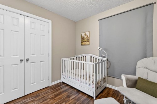 108 Cimarron Grove Circle, Okotoks, AB - Indoor Photo Showing Bedroom