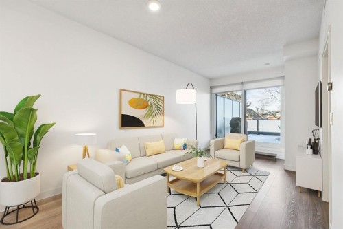 210-301 10 Street Nw, Calgary, AB - Indoor Photo Showing Living Room