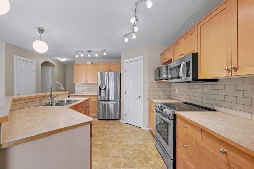 19 Copperfield Crescent Se, Calgary, AB - Indoor Photo Showing Kitchen With Double Sink