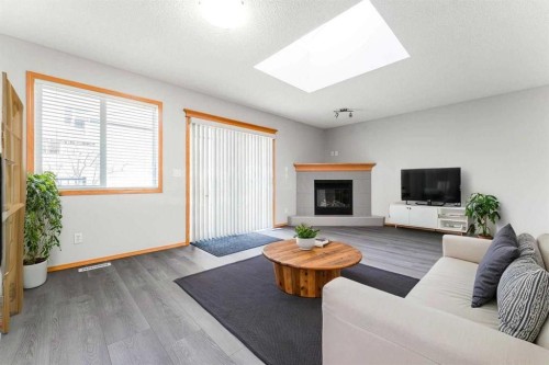 14 Taralea Bay Ne, Calgary, AB - Indoor Photo Showing Living Room With Fireplace