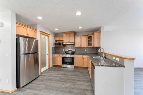 14 Taralea Bay Ne, Calgary, AB - Indoor Photo Showing Kitchen With Double Sink