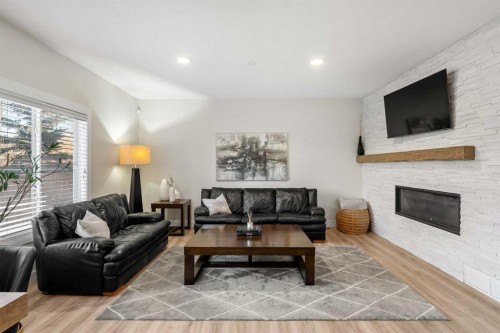 311 Chaparral Ravine View Se, Calgary, AB - Indoor Photo Showing Living Room With Fireplace