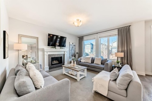 28 Ranchers Manor, Okotoks, AB - Indoor Photo Showing Living Room With Fireplace