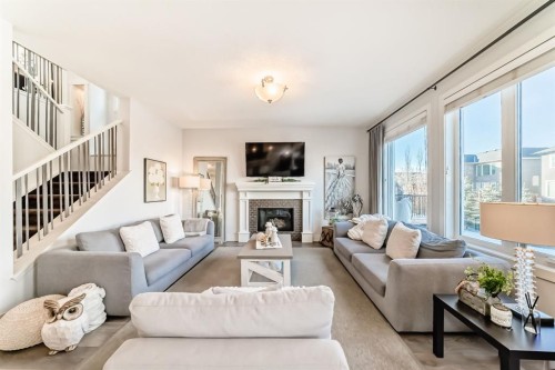 28 Ranchers Manor, Okotoks, AB - Indoor Photo Showing Living Room With Fireplace