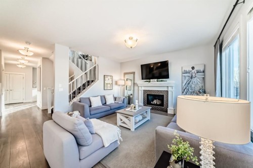 28 Ranchers Manor, Okotoks, AB - Indoor Photo Showing Living Room With Fireplace