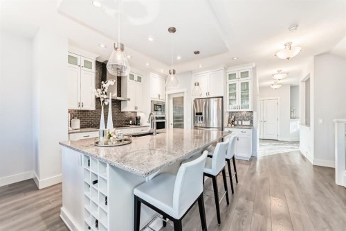 28 Ranchers Manor, Okotoks, AB - Indoor Photo Showing Kitchen With Stainless Steel Kitchen With Upgraded Kitchen
