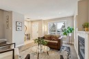 133 25 Avenue Ne, Calgary, AB  - Indoor Photo Showing Living Room With Fireplace 