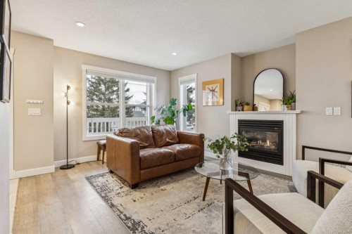 133 25 Avenue Ne, Calgary, AB - Indoor Photo Showing Living Room With Fireplace