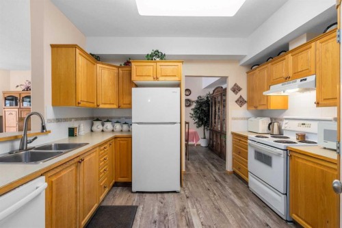 1206-151 Country Village Road Ne, Calgary, AB - Indoor Photo Showing Kitchen With Double Sink