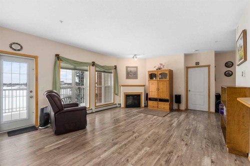 1206-151 Country Village Road Ne, Calgary, AB - Indoor Photo Showing Living Room With Fireplace