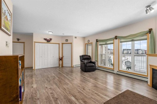1206-151 Country Village Road Ne, Calgary, AB - Indoor Photo Showing Living Room With Fireplace