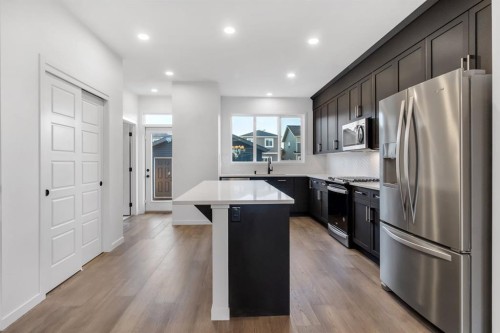 317 Midgrove Link Sw, Airdrie, AB - Indoor Photo Showing Kitchen With Stainless Steel Kitchen With Upgraded Kitchen