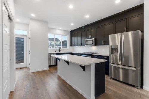 317 Midgrove Link Sw, Airdrie, AB - Indoor Photo Showing Kitchen With Stainless Steel Kitchen With Upgraded Kitchen