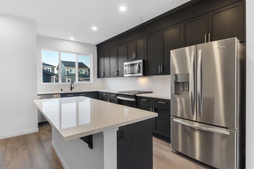 317 Midgrove Link Sw, Airdrie, AB - Indoor Photo Showing Kitchen With Stainless Steel Kitchen With Upgraded Kitchen