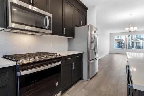 317 Midgrove Link Sw, Airdrie, AB - Indoor Photo Showing Kitchen With Stainless Steel Kitchen With Upgraded Kitchen
