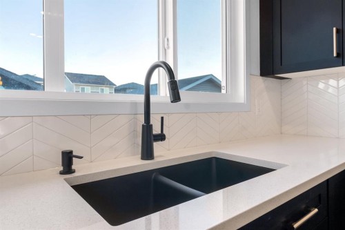 317 Midgrove Link Sw, Airdrie, AB - Indoor Photo Showing Kitchen With Double Sink