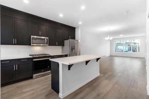 317 Midgrove Link Sw, Airdrie, AB - Indoor Photo Showing Kitchen With Stainless Steel Kitchen With Upgraded Kitchen