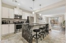 143 Masters Link Se, Calgary, AB  - Indoor Photo Showing Kitchen With Stainless Steel Kitchen With Upgraded Kitchen 