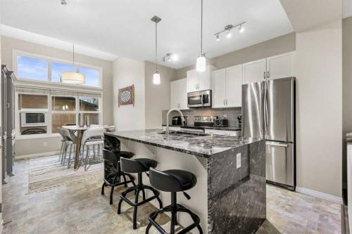 143 Masters Link Se, Calgary, AB - Indoor Photo Showing Kitchen With Stainless Steel Kitchen With Upgraded Kitchen