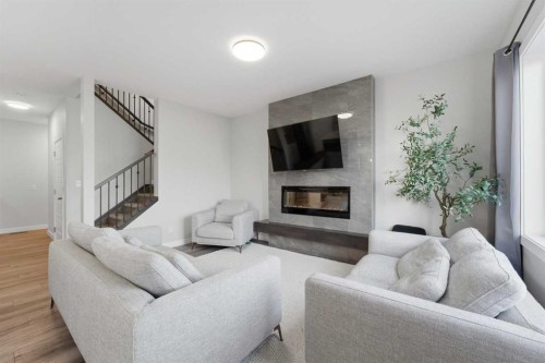 30 Belmont Crescent Sw, Calgary, AB - Indoor Photo Showing Living Room With Fireplace