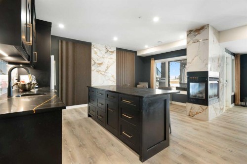 71 Muirfield Close, Lyalta, AB - Indoor Photo Showing Kitchen With Fireplace With Double Sink