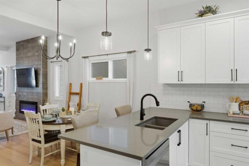 937 Reynolds Lane, Airdrie, AB - Indoor Photo Showing Kitchen With Double Sink With Upgraded Kitchen