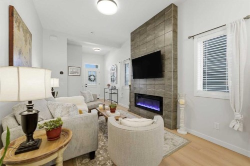 937 Reynolds Lane, Airdrie, AB - Indoor Photo Showing Other Room With Fireplace