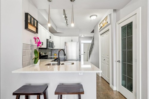 12-140 Rockyledge View Nw, Calgary, AB - Indoor Photo Showing Kitchen With Double Sink With Upgraded Kitchen