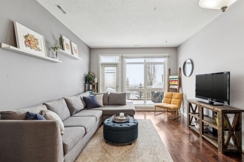12-140 Rockyledge View Nw, Calgary, AB - Indoor Photo Showing Living Room