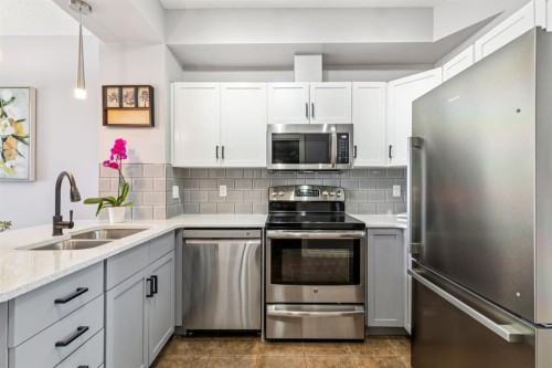 12-140 Rockyledge View Nw, Calgary, AB - Indoor Photo Showing Kitchen With Stainless Steel Kitchen With Double Sink With Upgraded Kitchen