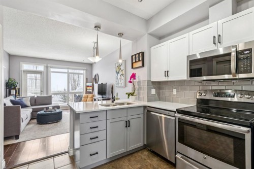 12-140 Rockyledge View Nw, Calgary, AB - Indoor Photo Showing Kitchen With Stainless Steel Kitchen With Double Sink With Upgraded Kitchen