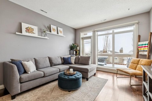12-140 Rockyledge View Nw, Calgary, AB - Indoor Photo Showing Living Room