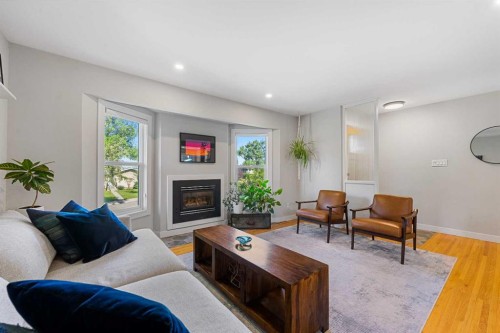 15 Fielding Drive Se, Calgary, AB - Indoor Photo Showing Living Room With Fireplace